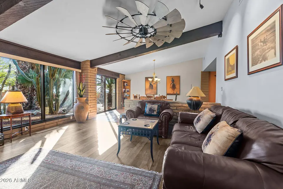Great room with picture windows and the dining area beyond