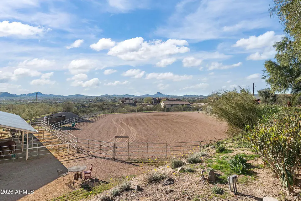 Arena and covered stalls from the hillside, mountains beyond
